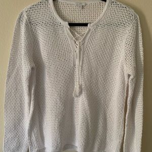 White knit sweater with tassel